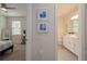 Hallway showcasing a bedroom and bathroom; natural light and stylish decor at 288 Soliera St, Nokomis, FL 34275