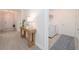 Hallway featuring a wooden console table leading into the laundry room at 288 Soliera St, Nokomis, FL 34275