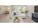 Open-concept living space flows into the lanai and features comfortable seating and natural light at 288 Soliera St, Nokomis, FL 34275