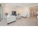 Open-concept living room with plenty of space for entertaining, a neutral color palette, and lots of natural light at 288 Soliera St, Nokomis, FL 34275