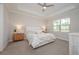 Relaxing main bedroom with a tray ceiling, neutral tones, and lots of natural light at 288 Soliera St, Nokomis, FL 34275