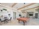 A game room with a pool table, bar, and seating offers residents entertainment options at 288 Soliera St, Nokomis, FL 34275