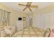 Cozy bedroom featuring a TV, dresser and a plush chair at 335 Auburn Woods Cir, Venice, FL 34292