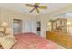 Bedroom featuring a dresser with mirror and a glimpse into the bathroom at 335 Auburn Woods Cir, Venice, FL 34292
