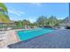 A sparkling community pool with a shallow end and lots of space for lounging at 335 Auburn Woods Cir, Venice, FL 34292