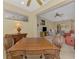 Game room with checkerboard table and comfortable seating, connecting to the rest of the open living space at 335 Auburn Woods Cir, Venice, FL 34292