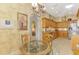 Charming eat-in kitchen with wood cabinets, modern appliances, and tiled floors at 335 Auburn Woods Cir, Venice, FL 34292