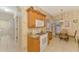 Well-equipped kitchen with stainless appliances, granite countertops, and a cozy breakfast nook at 335 Auburn Woods Cir, Venice, FL 34292