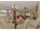Open floor plan with dining area and living room featuring plenty of natural light and comfortable seating at 335 Auburn Woods Cir, Venice, FL 34292