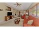 Inviting living room with comfortable seating, entertainment center and cozy decor at 335 Auburn Woods Cir, Venice, FL 34292