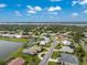 Beautiful aerial view of a waterfront community with lush landscaping and stunning lake views at 351 Eden Dr, Englewood, FL 34223