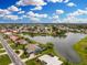Waterfront home on a private lake, with lush landscaping and community fountain at 351 Eden Dr, Englewood, FL 34223