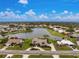 Birds-eye view of home located on a lake at 351 Eden Dr, Englewood, FL 34223