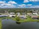 Aerial view of a beautiful waterfront home with private pool and lush backyard at 351 Eden Dr, Englewood, FL 34223