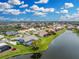 Beautiful waterfront home with a charming garden overlooking a serene lake at 351 Eden Dr, Englewood, FL 34223