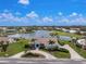 Expansive aerial view of a waterfront home showcasing the tiled roof, and lush landscaping at 351 Eden Dr, Englewood, FL 34223