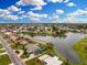 Waterfront home highlighted by red circle on a private lake, with lush landscaping and community fountain at 351 Eden Dr, Englewood, FL 34223