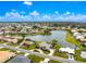 Expansive aerial view of a charming lakeside community with beautiful homes and lush landscaping at 351 Eden Dr, Englewood, FL 34223