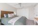 Bedroom featuring neutral colored walls and carpet, a bed with a wicker headboard, and closet at 351 Eden Dr, Englewood, FL 34223