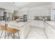 Spacious kitchen featuring an island with seating, stainless steel appliances, and ample cabinet space at 351 Eden Dr, Englewood, FL 34223