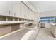 Bright kitchen with stainless steel appliances, ample cabinet space, and views of the water at 351 Eden Dr, Englewood, FL 34223