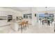 Modern kitchen with stainless steel appliances and an island with bar seating at 351 Eden Dr, Englewood, FL 34223