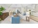 Spacious living room with neutral carpet, comfortable seating, wood accents, and natural light at 351 Eden Dr, Englewood, FL 34223