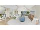 Living room with large windows, high ceilings, and views of the lake at 351 Eden Dr, Englewood, FL 34223