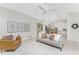 Comfortable living room with tile floors, neutral decor, and views into the kitchen at 351 Eden Dr, Englewood, FL 34223