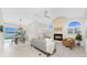 Bright living room featuring a fireplace, tile floors, and views of the pool and lake at 351 Eden Dr, Englewood, FL 34223