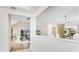 Bright living room with light wood floors and a view of the lake at 351 Eden Dr, Englewood, FL 34223