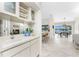 Wet bar with a sink and wine storage, adjacent to the dining area at 351 Eden Dr, Englewood, FL 34223