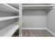 This walk-in closet has shelves and a hanging rod at 429 Cerromar Ln # 352, Venice, FL 34293