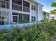 Exterior view of building with screened in patios at 429 Cerromar Ln # 352, Venice, FL 34293
