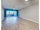 Bright living room featuring sliding glass doors leading to balcony and fan to circulate the fresh air at 429 Cerromar Ln # 352, Venice, FL 34293