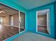 Enclosed patio featuring tile flooring and access to the living room and front door at 429 Cerromar Ln # 352, Venice, FL 34293