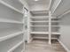 This walk-in closet has shelves and hanging space at 429 Cerromar Ln # 352, Venice, FL 34293
