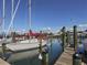 Marina scene with sailboats docked along wooden piers, offering waterfront views and boating opportunities at 432 Sunset Lake Blvd # 205, Venice, FL 34292