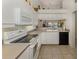 Well-maintained kitchen features modern appliances, ample counter space, and a view into the living area at 432 Sunset Lake Blvd # 205, Venice, FL 34292