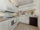 The kitchen has modern appliances, plenty of counter space, and opens to the living area at 432 Sunset Lake Blvd # 205, Venice, FL 34292