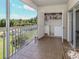 Screened lanai with washer, dryer, storage and a beautiful view of the community pond at 432 Sunset Lake Blvd # 205, Venice, FL 34292