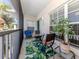 Relaxing screened patio with seating area, perfect for enjoying the outdoors with a view of the community at 432 Sunset Lake Blvd # 205, Venice, FL 34292