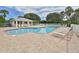 Inviting community pool with ample lounge chairs and well-maintained deck at 432 Sunset Lake Blvd # 205, Venice, FL 34292