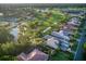 Aerial view showcasing golf course and real estate of Boca Royale Golf and Country Club at 48 Grande Fairway, Englewood, FL 34223