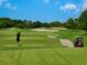 Golf course image at Boca Royale Golf and Country Club showcasing green and sand traps at 48 Grande Fairway, Englewood, FL 34223