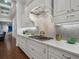 Gourmet kitchen boasts custom cabinets, a stylish backsplash, and high-end appliances at 48 Grande Fairway, Englewood, FL 34223