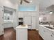 Well-appointed kitchen features white cabinetry, built-in appliances, and an open layout at 48 Grande Fairway, Englewood, FL 34223