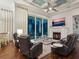 Inviting living room features a fireplace, comfortable seating, and sliding glass doors to the outdoor living space at 48 Grande Fairway, Englewood, FL 34223