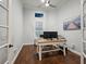 Home office with a functional desk, natural light, and a serene atmosphere, perfect for productivity at 48 Grande Fairway, Englewood, FL 34223