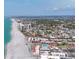 Stunning aerial view of the community, beach, and coastal homes on a sunny day at 500 Park S Blvd # 62, Venice, FL 34285